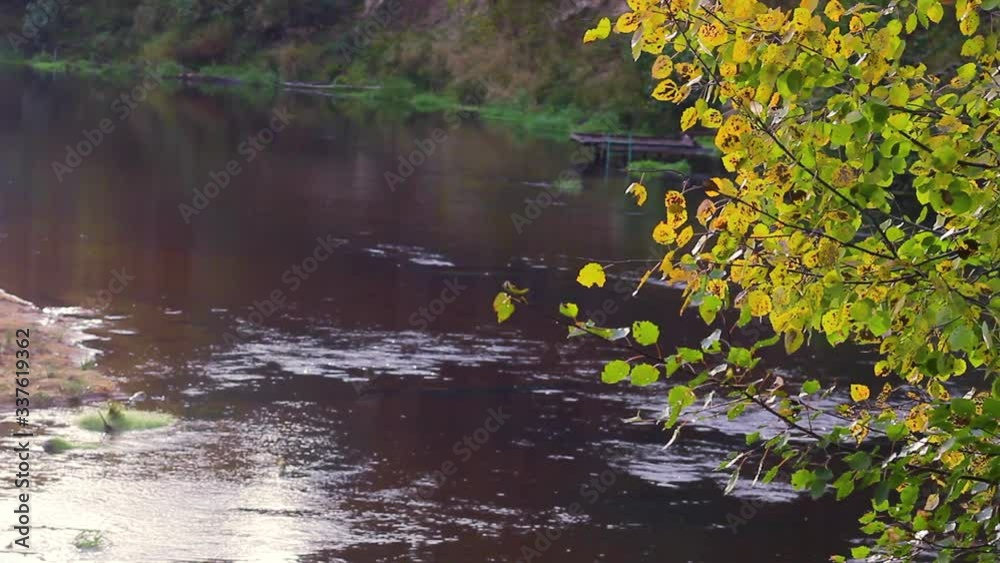 River on sunset in autumn time. Sunrise scenic landscape with water in sunlight. Golden water surface at sunset, background. River on sunset in autumn time. Sunrise scenic landscape with water in sunlight. Golden water surface at sunset, background.