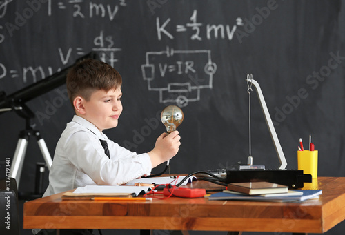 Cute little boy at physics ...
