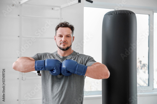 Male boxer training in gym