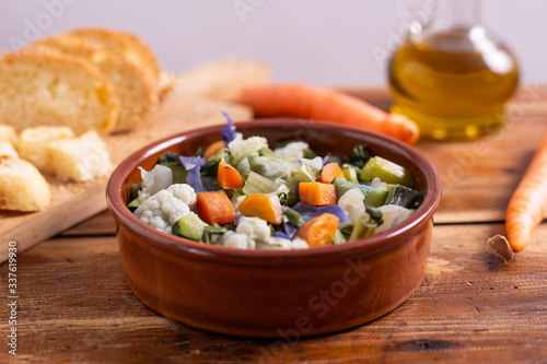 Mixed fresh vegetables with bread. Minestrone, detox food. 