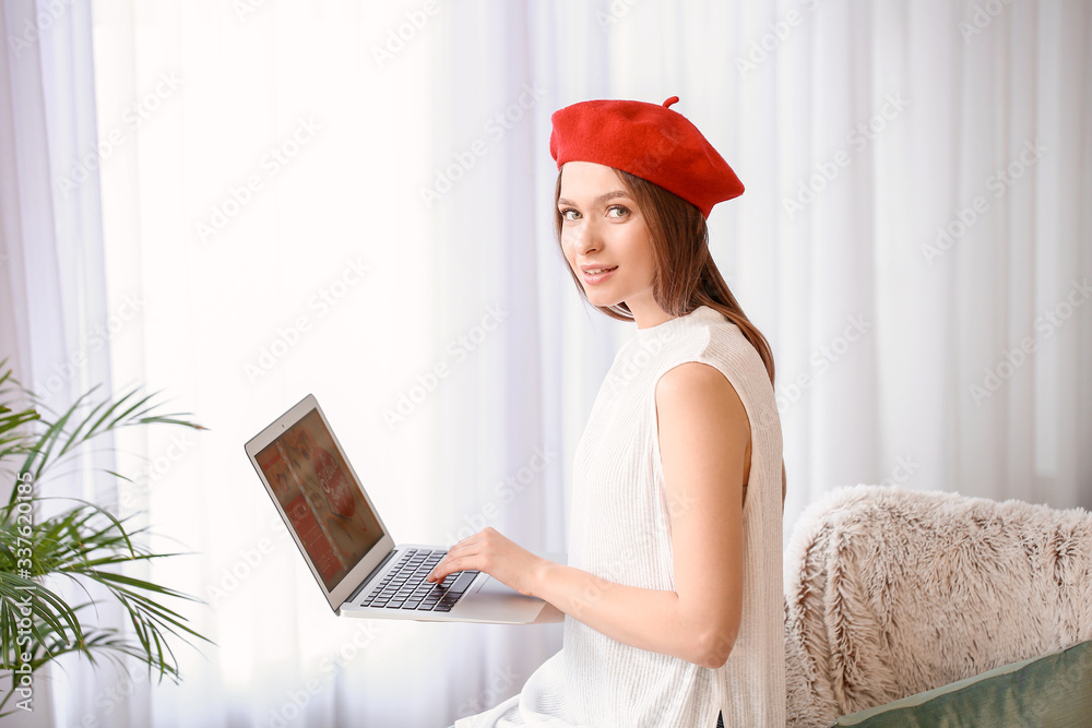 Young woman with laptop at home. Online shopping concept Young woman with laptop at home. Online shopping concept