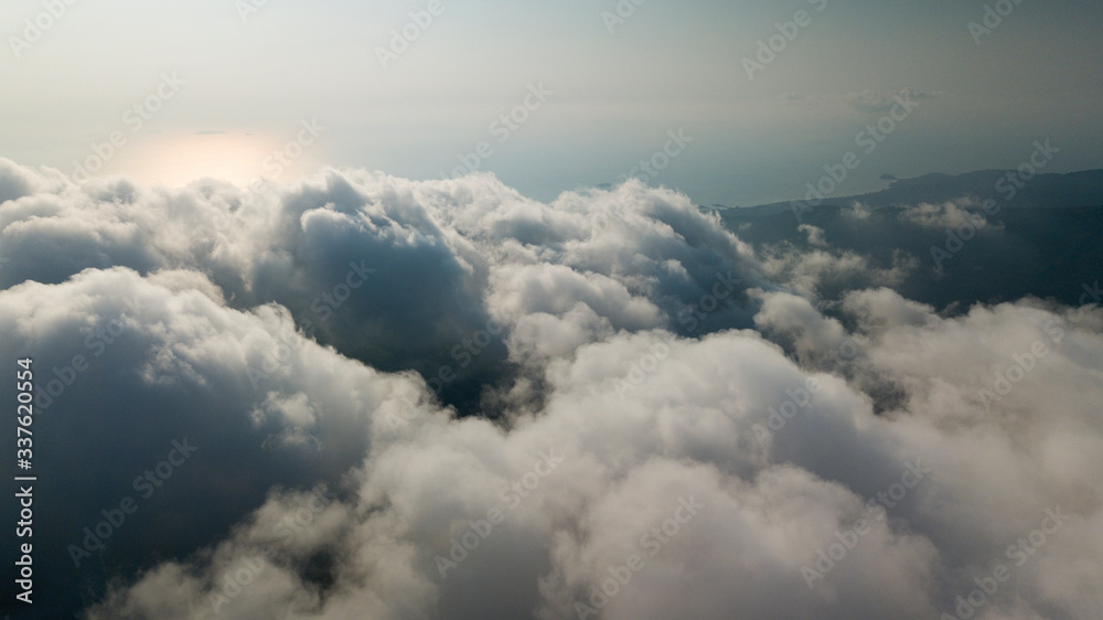 High altitude drone photo of cumulus clouds and sun High altitude drone photo of cumulus clouds and sun