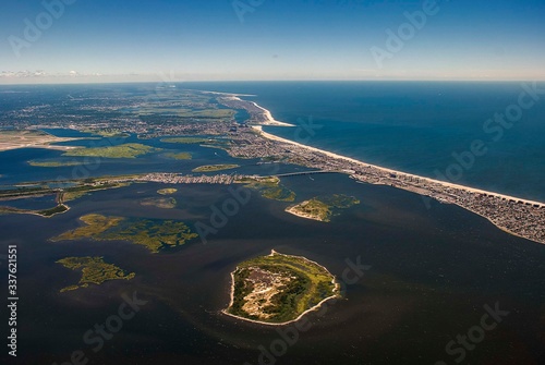 The Rockaway peninsula in Queens, New York from the air separating Jamaica Bay from the Atlantic Ocean photo