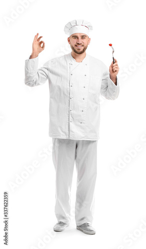 Handsome male chef showing ...