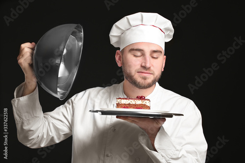 Handsome male chef with tas...