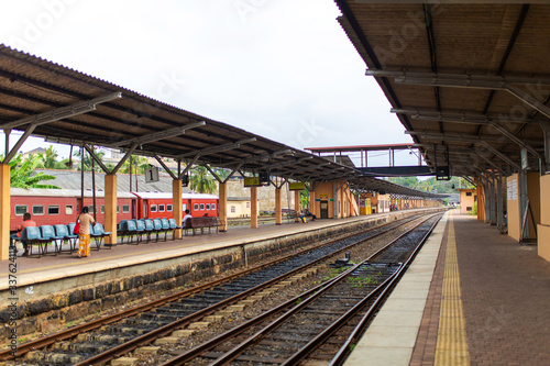 People are waiting for the train at the railway station in Sri Lanka.