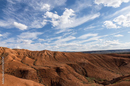 baguty red sand mountains tourist attraction with cloudy sky near Almaty, Kazakhstan © anyabr