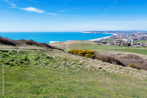 View of Seaford town in East Sussex, England from the golf course, beach and blue sea, selective focus