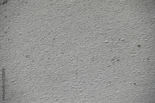 The surface of the rough gray cement wall. High resolution