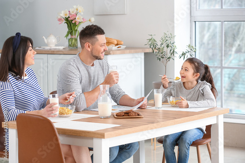 Family drinking milk during...