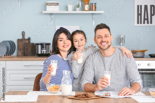 Family drinking milk during...