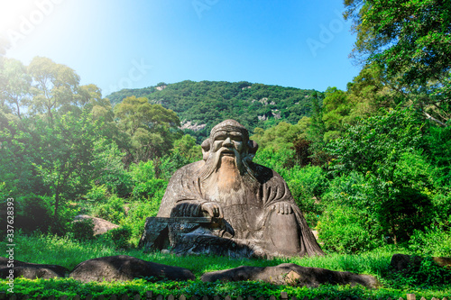 Laozi statue on Qingyuan Mountain, Quanzhou, China. 1,000-year-old Taoist stone carvings. photo