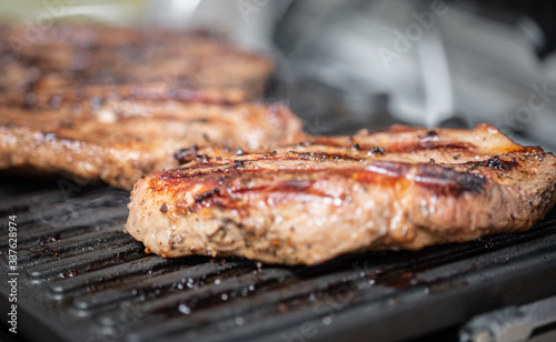 Delicious electric grilled meat steaks