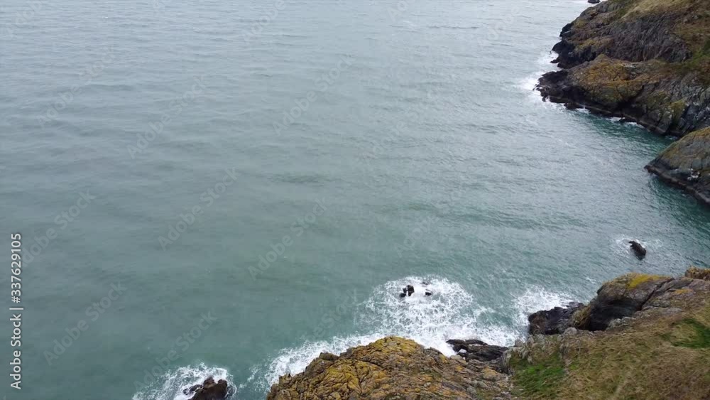 4K Epic Aerial Over A Rocky Valley and coastline beside wide ocean in Ireland,Europe 4K Epic Aerial Over A Rocky Valley and coastline beside wide ocean in Ireland,Europe