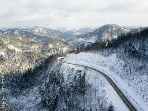 road trip across akan lake national park area in hokkaido in winter season photo