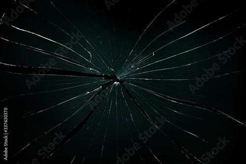 Broken and cracked glass with hole