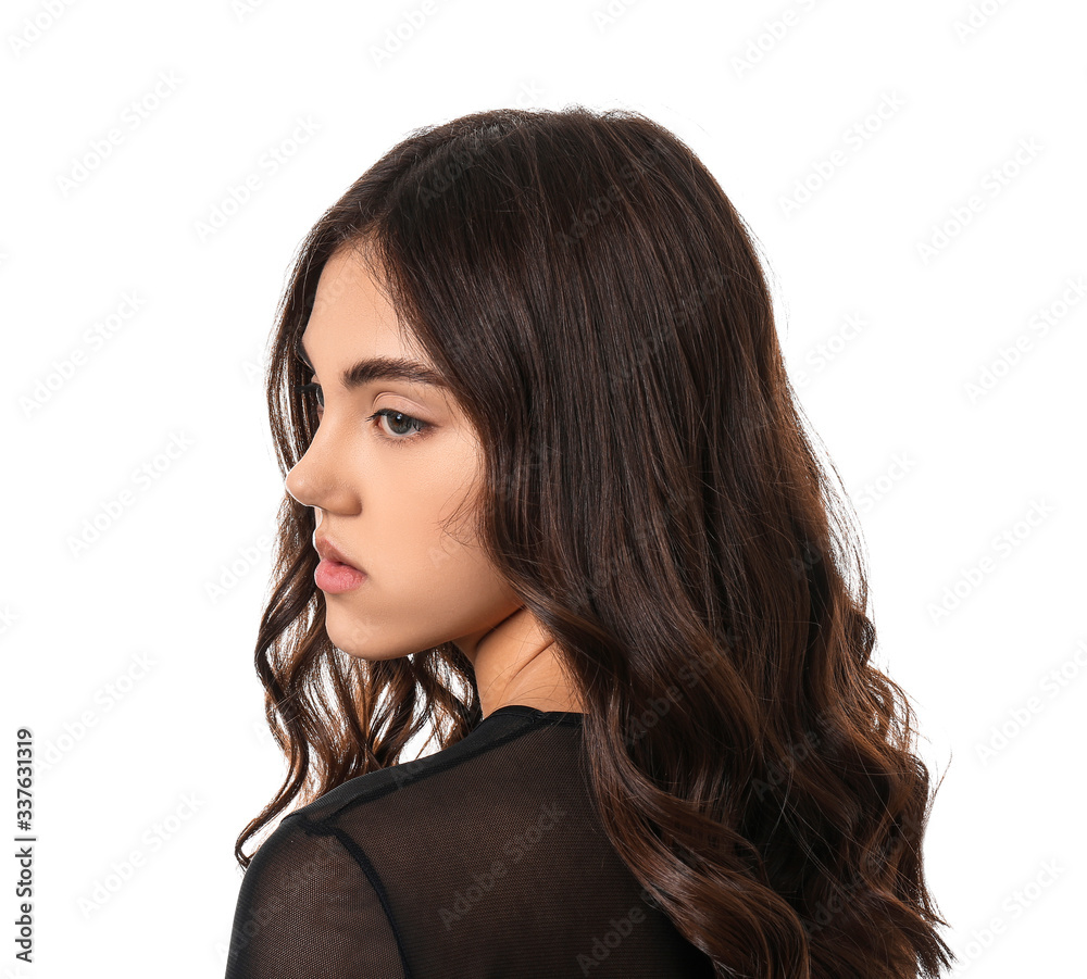 Naklejka premium Young woman with beautiful curly hair on white background