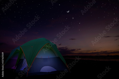 Rest tents in the field in bright starry night