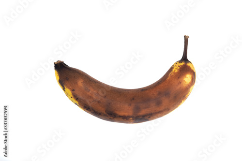 Brown rotten banana isolated on white background.
