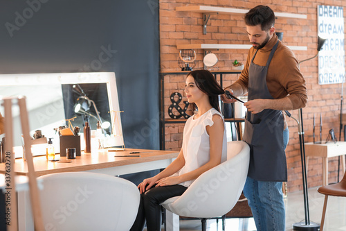 Hairdresser working with cl...