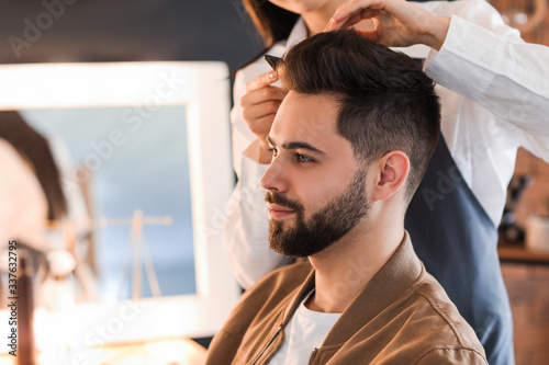 Hairdresser working with cl...