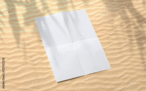 Folded blank poster flyer on beach sand with floral shadow for event promotion, design presentation, portfolio etc.