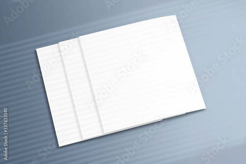 High view of 3 closed square magazines brochure with window overlay shadow on grey textured background as template for design presentation, branding promotion etc.