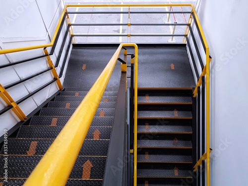 The walkway shows safe climbing using the yellow arrows to indicate walking direction, Fire escape stairs, Steel stairs and rails.