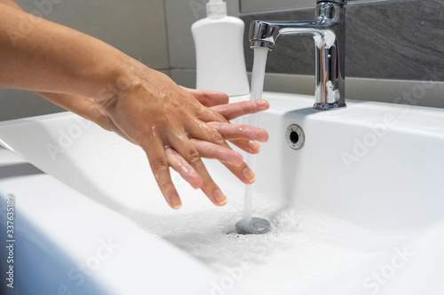 Washing hands rubbing with soap woman for corona virus prevention, hygiene to stop spreading coronavirus