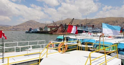 Peru Lake Titicaca tourist boats at the port of Puno photo