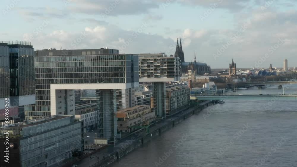 AERIAL: Cologne Futuristic Kranhaus, Crane House Apartments, Office Buildings in beautiful Sunlight with reflections AERIAL: Cologne Futuristic Kranhaus, Crane House Apartments, Office Buildings in beautiful Sunlight with reflections