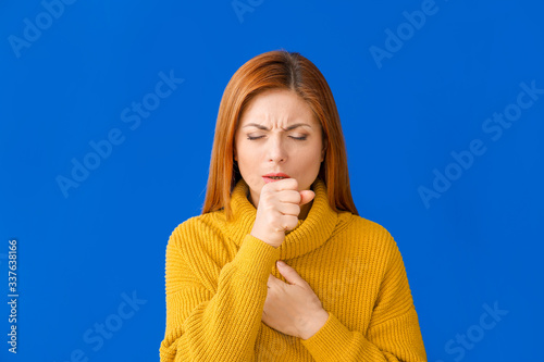 Coughing woman on color bac...