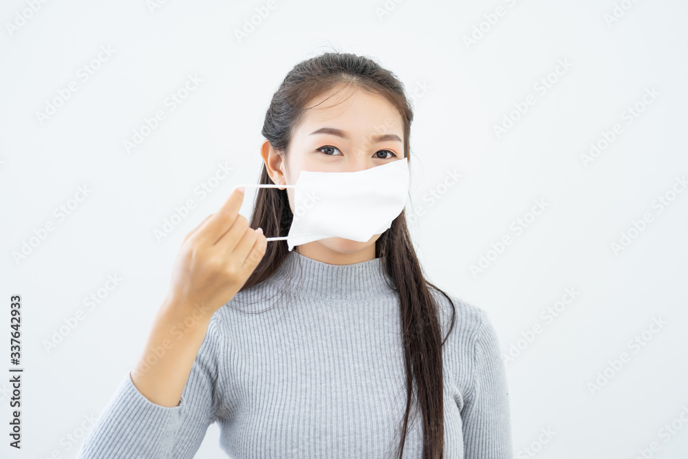 Woman wearing face mask protective for spreading of disease virus SARS-CoV-2 with copy space, protection virus Covid-19 Coronavirus concept Woman wearing face mask protective for spreading of disease virus SARS-CoV-2 with copy space, protection virus Covid-19 Coronavirus concept