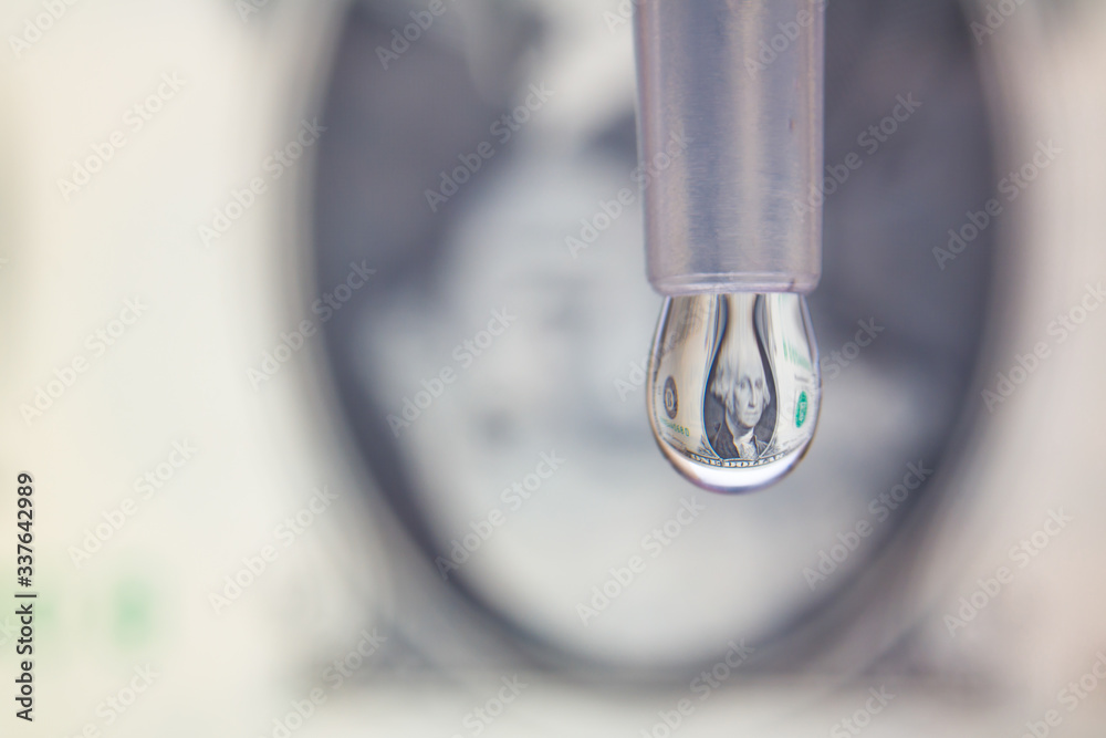 One dollar bill reflects in a drop. Saving money or last dollar concept One dollar bill reflects in a drop. Saving money or last dollar concept