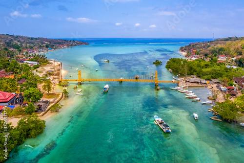 Aerial view of Yellow bridge between the islands of Nusa Ceningan and Nusa Le...