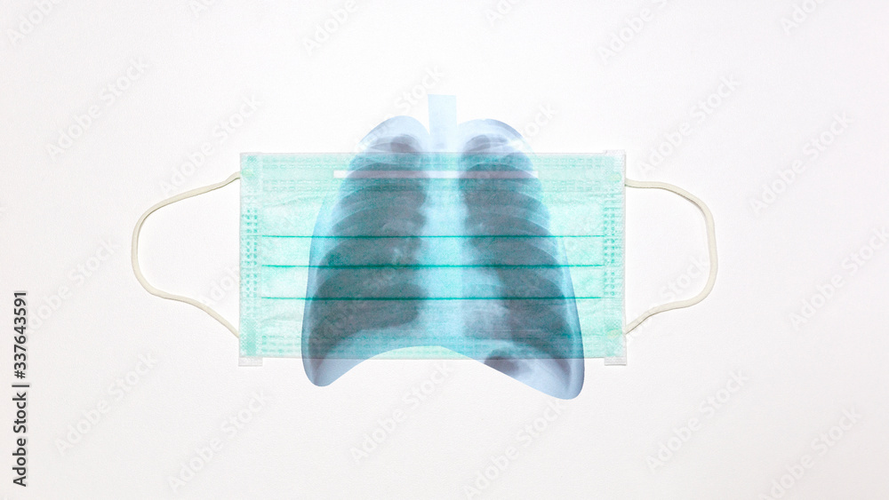 Respiratory surgical mask and lung x-ray film on white background Respiratory surgical mask and lung x-ray film on white background