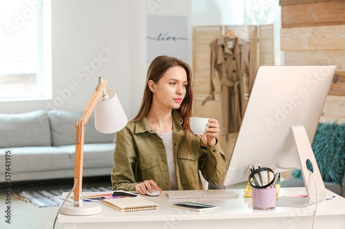 Young designer working on c...