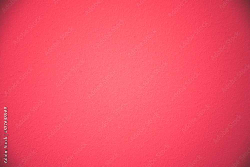 Fototapeta premium Texture of a red painted wall. Rich red color with vignetting.