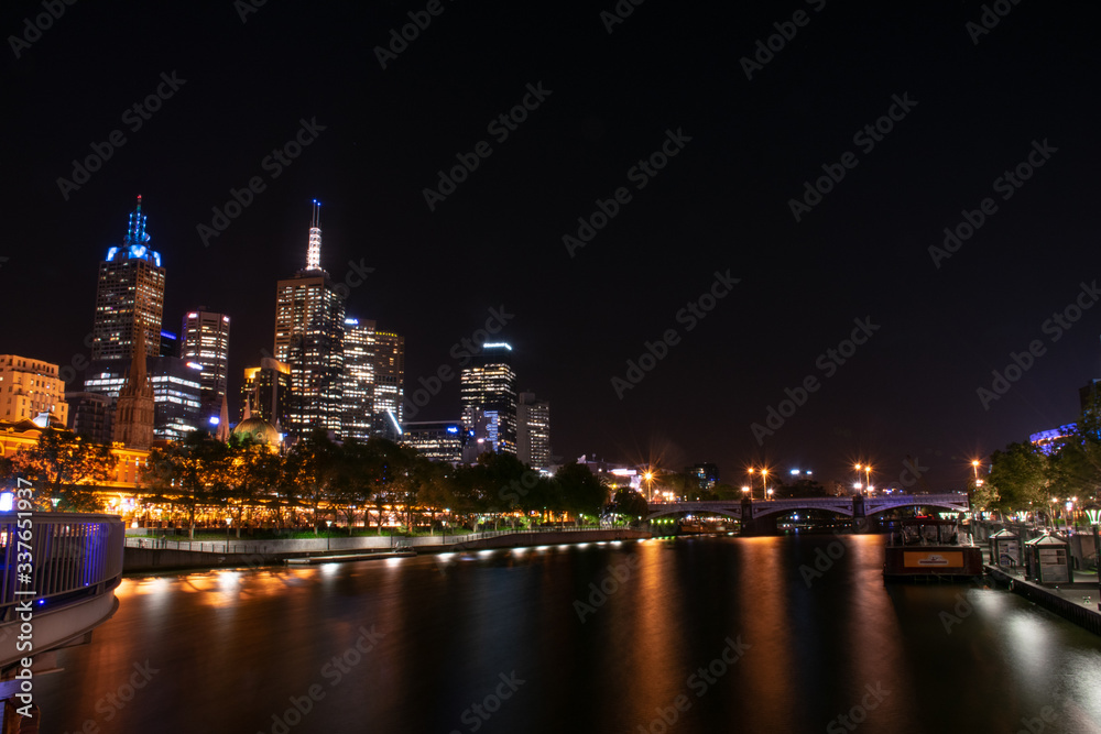 The cityscape of Melbourne city near Yarra river at night in Australia