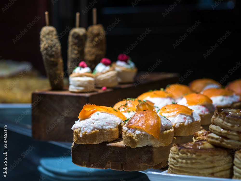 Fototapeta premium Close-up of a typical basque pincho or tapa made of salmon and crayfish in a bar of Vitoria, Basque Country, Spain