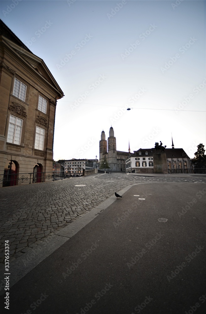 Empty cathedral bridge with Hans Waldmann statue and Grossmunster in the morning in the city of Zurich Switzerland