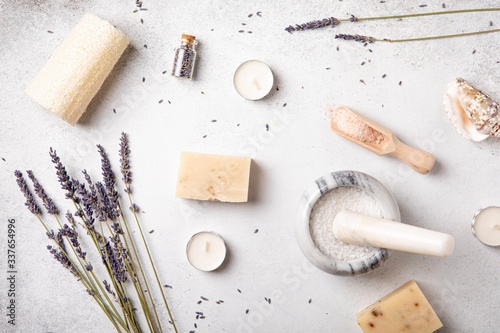 Handmade soap and oils with lavender flowers. Health and self-care. Essential fragrance aromatherapy. Natural background. Top view, copy space, flat lay. Natural cosmetic.