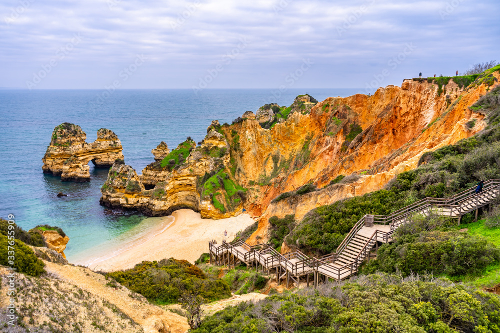 Camilo Beach in Lagos, Portugal, with its rock cliffs and blue ocean. Algarve, Portugal.