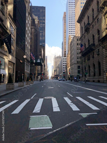 Manhattan, New York, USA. 2020. Looking south on 5th Avenue at 55th Street - Usually very busy shopping area in Midtown.  Seen during the Coronavirus lockdown period.