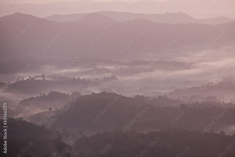Twilight, sunrise and sea of fog in the morning on the mountains of northern Thailand, during the rainy season. Twilight, sunrise and sea of fog in the morning on the mountains of northern Thailand, during the rainy season.