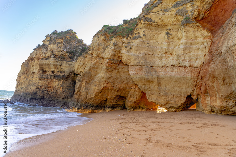 Rocks on the shore of Atlantic ocean in Algarve Portugal. 