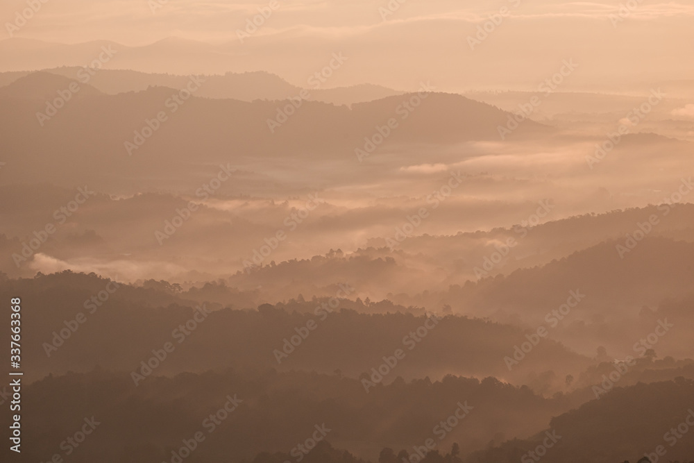 Twilight, sunrise and sea of fog in the morning on the mountains of northern Thailand, during the rainy season.