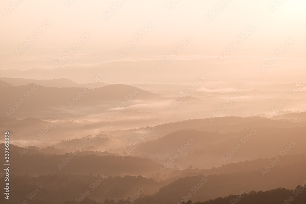 Twilight, sunrise and sea of fog in the morning on the mountains of northern Thailand, during the rainy season.