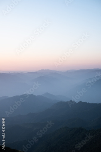 Twilight, sunrise and sea of fog in the morning on the mountains of northern Thailand, during the rainy season. © Anon