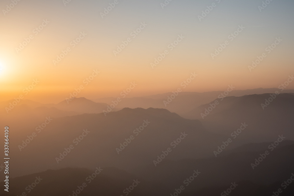 Twilight, sunrise and sea of fog in the morning on the mountains of northern Thailand, during the rainy season.